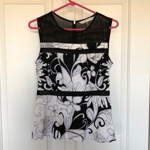 Trina Turk sleeveless black and white peplum top.
